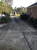 Before a completed residential pressure washing services project in the area